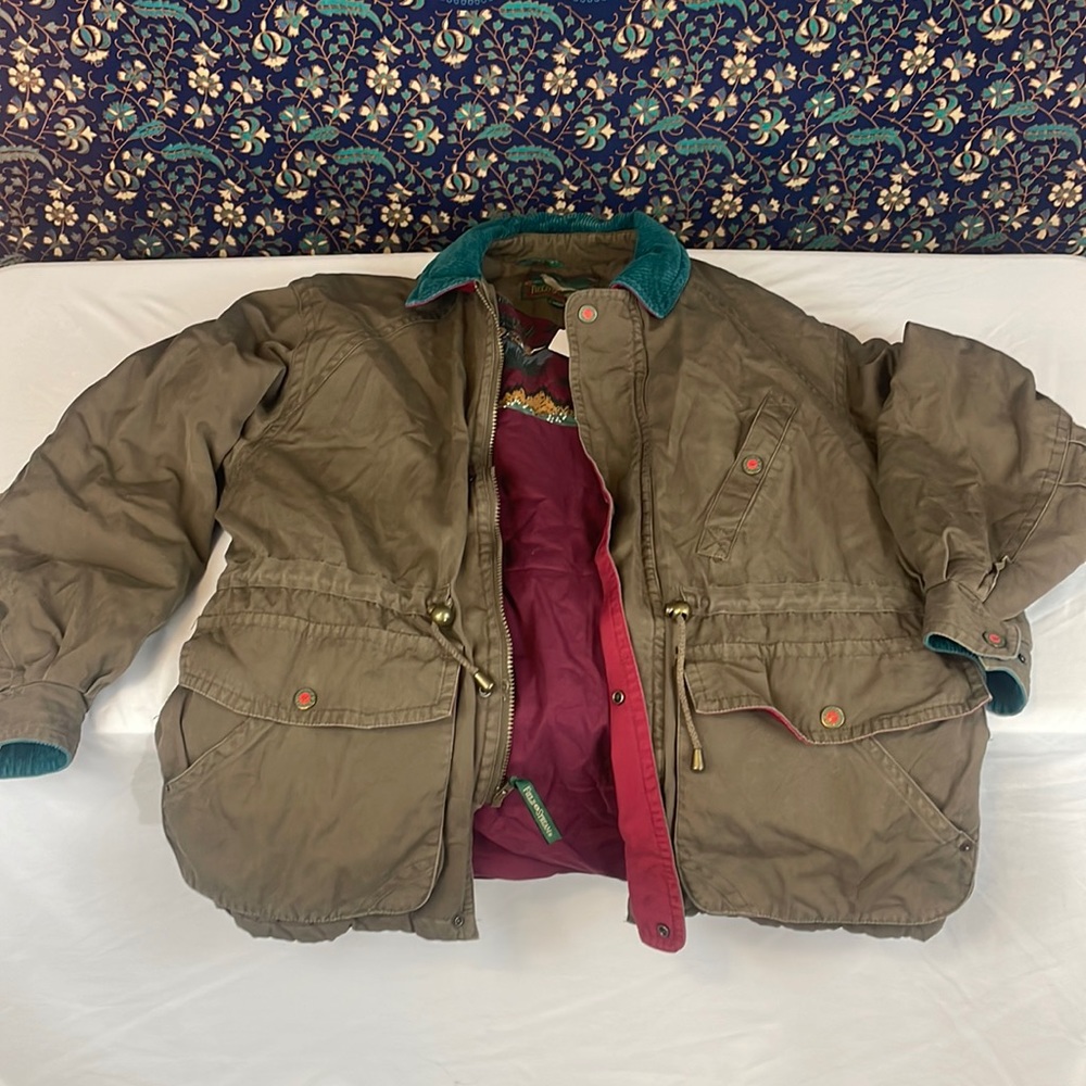 Field and stream bomber jacket with teal corduroy collar and maroon lining.
